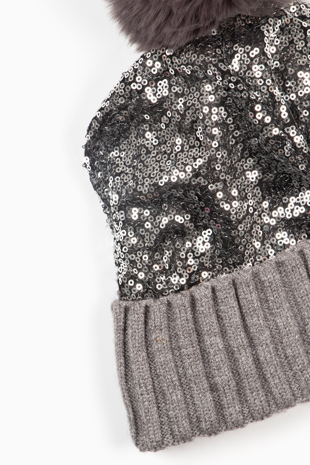 close up of the sequin and contrasting ribbed knitted rim of the hat.