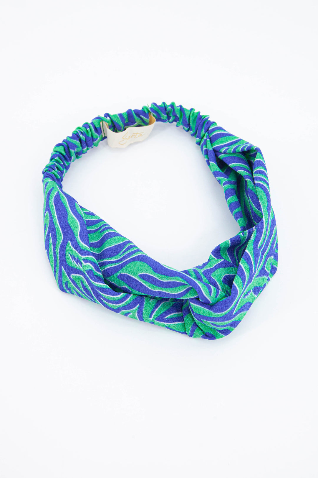 green and blue zebra print fabric head band with twisted front and elasticated back