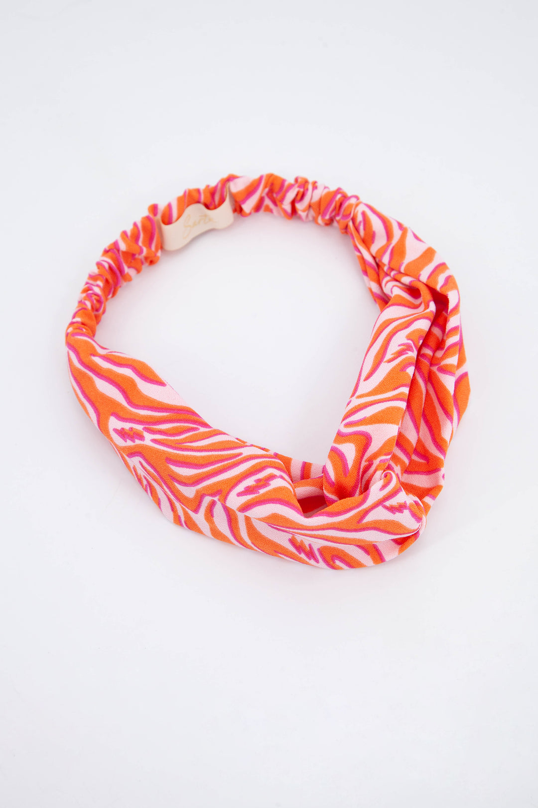 orange and pink zebra print fabric head band with twisted front and elasticated back