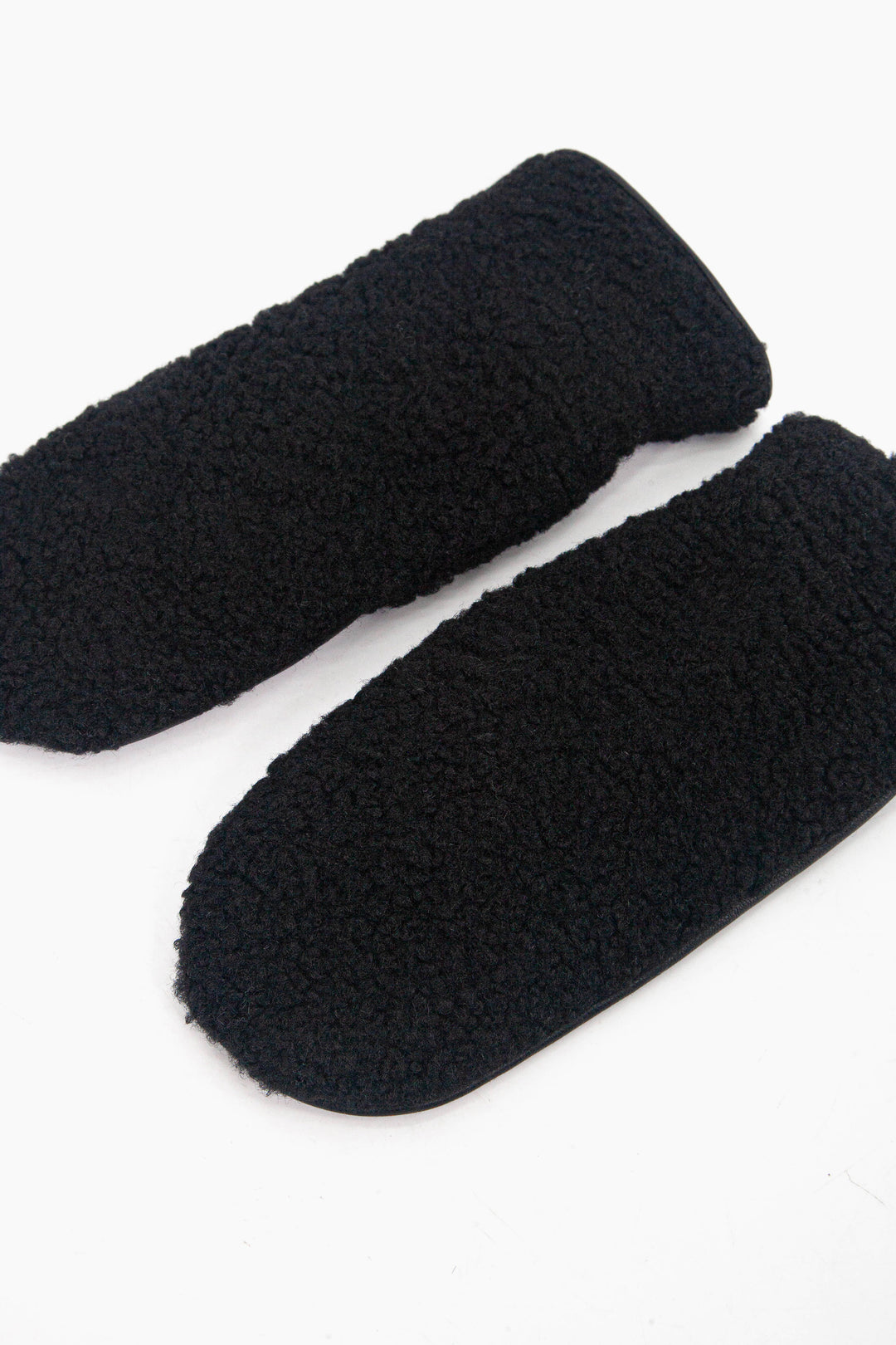 showing the mitts laying flat, the black borg fleece is shown to cover the entire back of the gloves.