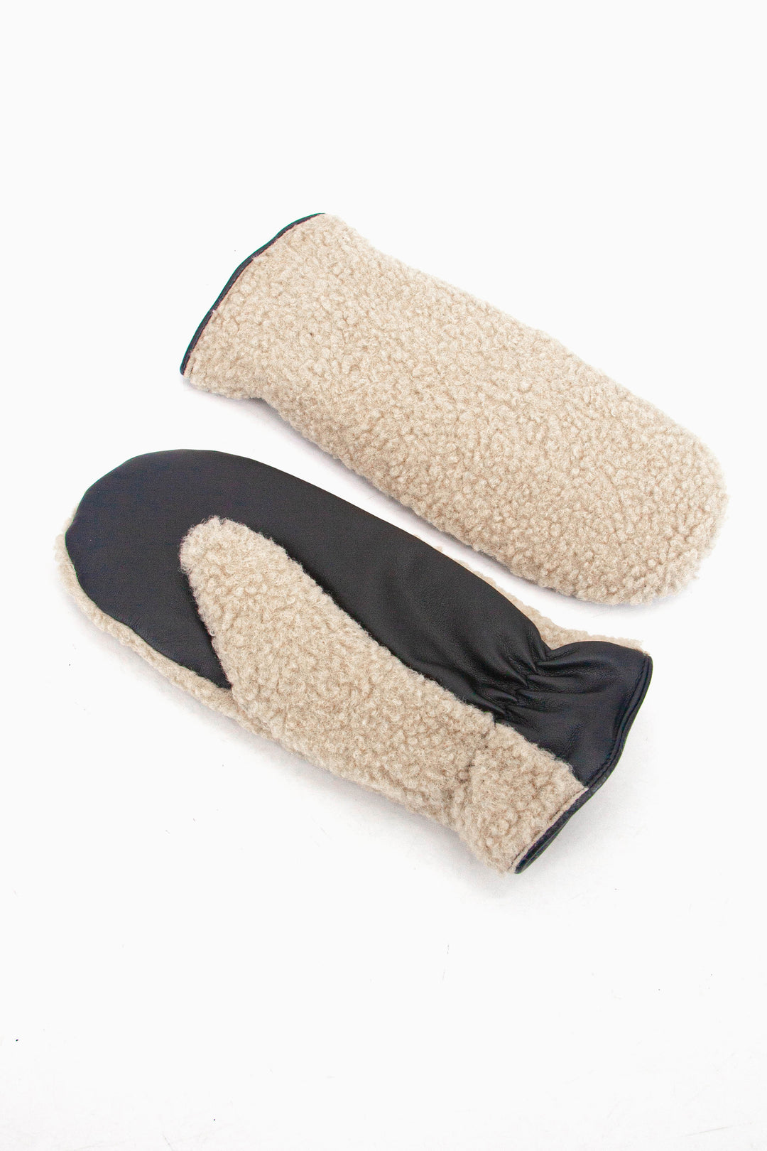 showing the fleece mittens laying flat, one is palm up the other palm down. the fleece is only on the back of the glove, the palm is black and made from polyester.