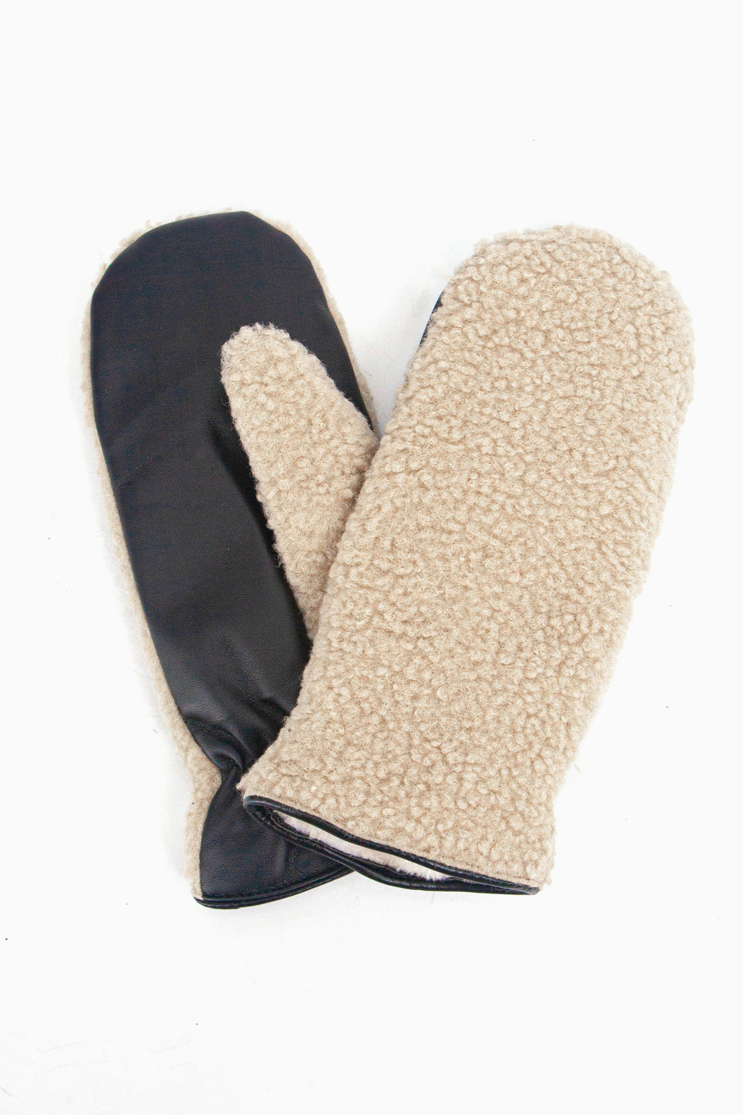 showing the gloves close up, there is an inner lining which is white, the trim around the edge of the cuffs is polyester. 