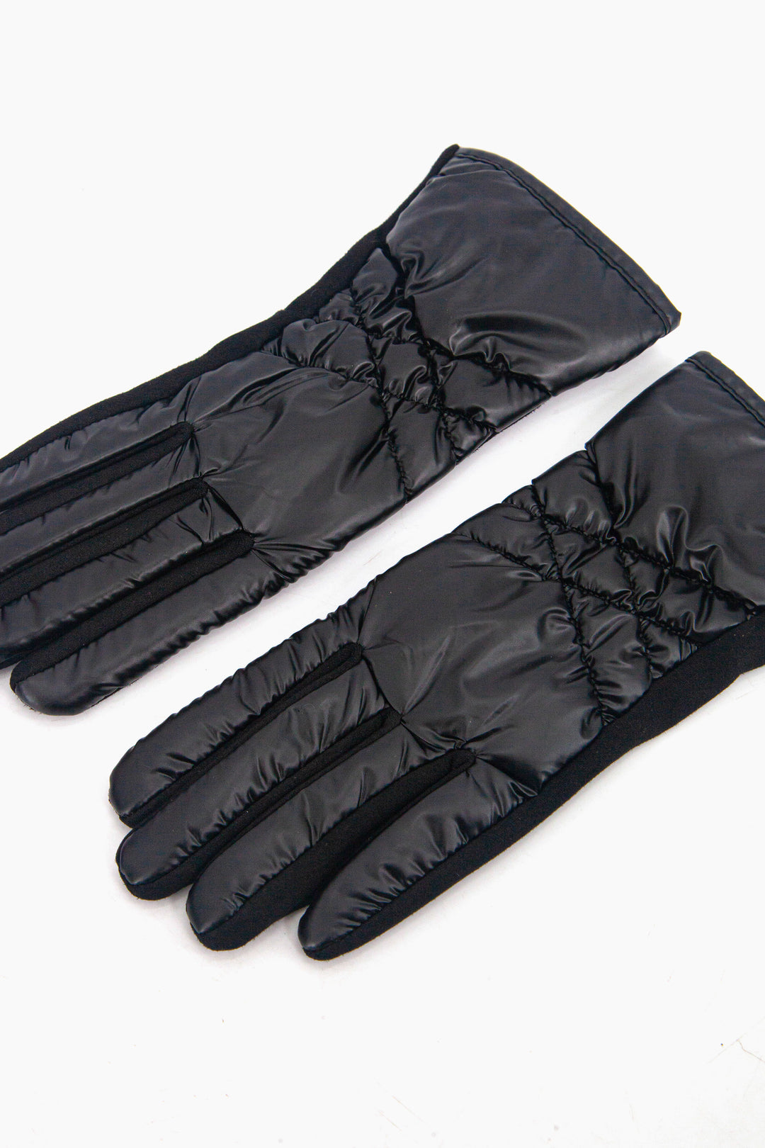 metallic black gloves with an x shaped stitched cross on the back of the hand, giving the gloves a quilted appearance.