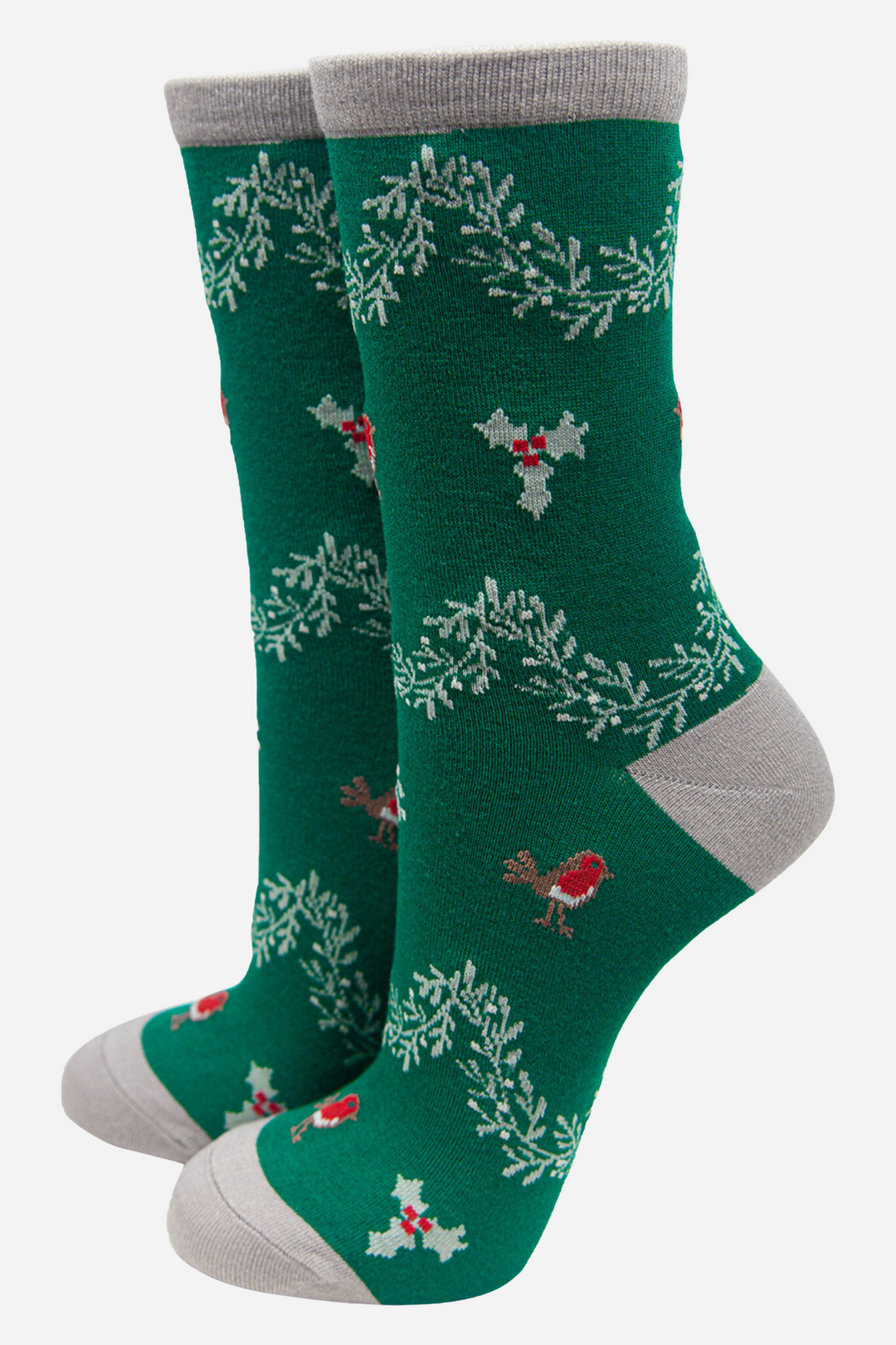 green socks with a grey heel, toe and cuff with an pattern of red robin birds, mistletoe and hanging boughs of holly