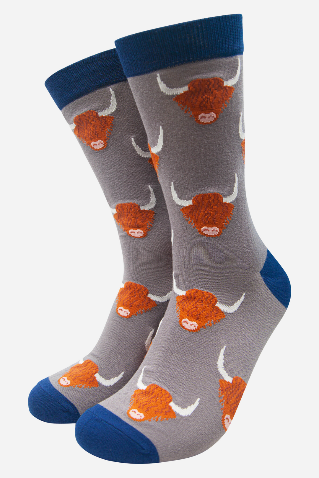 grey socks with blue heel, toe and cuff with an all over orange highland cow pattern