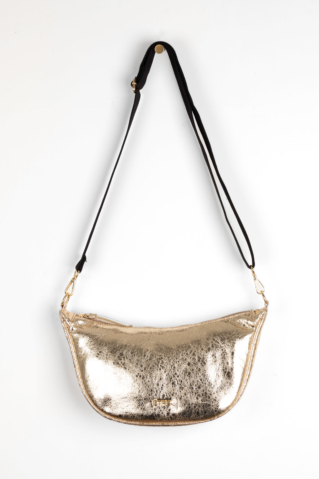 faux cracked leather metallic gold half moon crossbody bag with a black canvas detachable strap