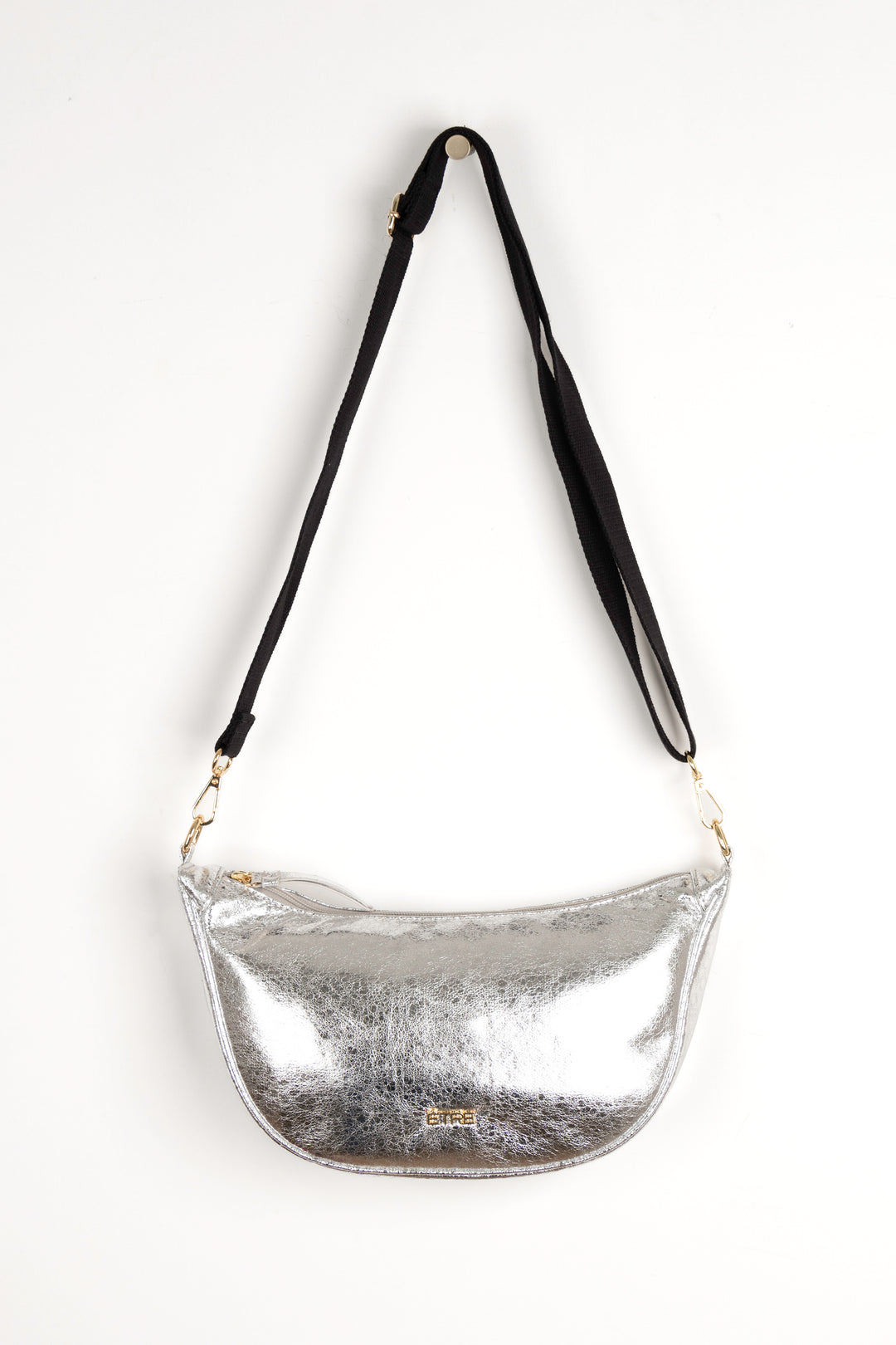 faux cracked leather metallic silver half moon crossbody bag with a black canvas detachable strap