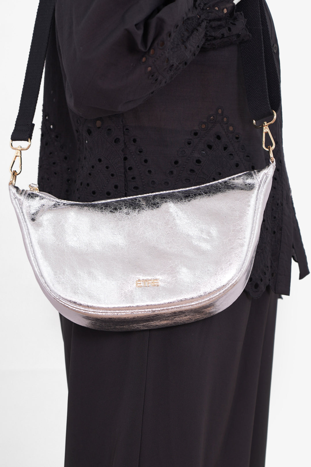 bellamy-half-moon-crossbody-bag-silver-cracked-metallic-worn-by-model