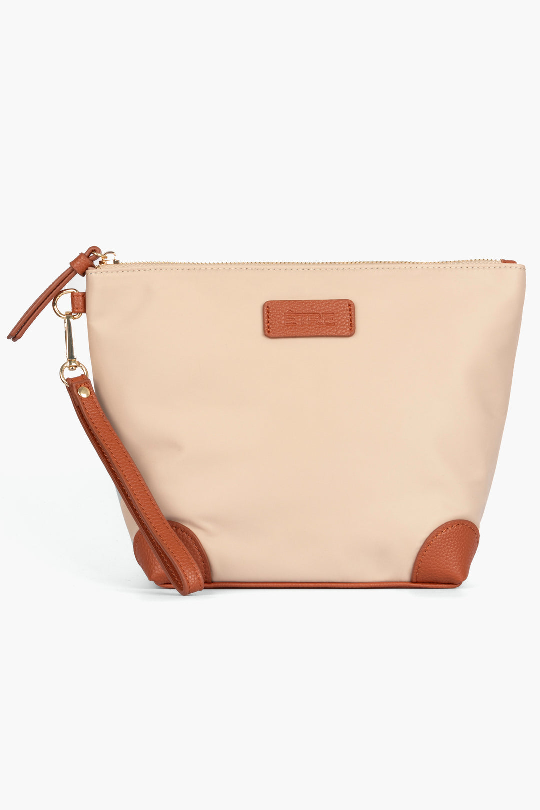 cream coloured vanity bag with tan pleater accents and detachable wrist strap