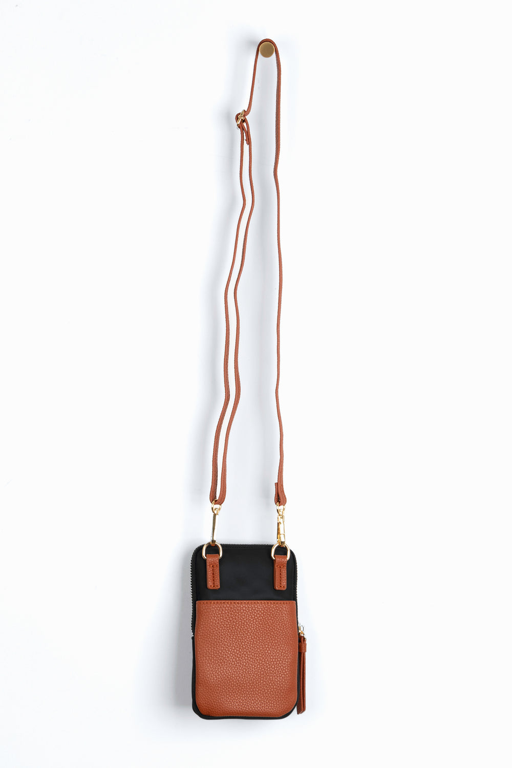 showing the back of the phone bag, there is a tan faux leather external open pocket. 