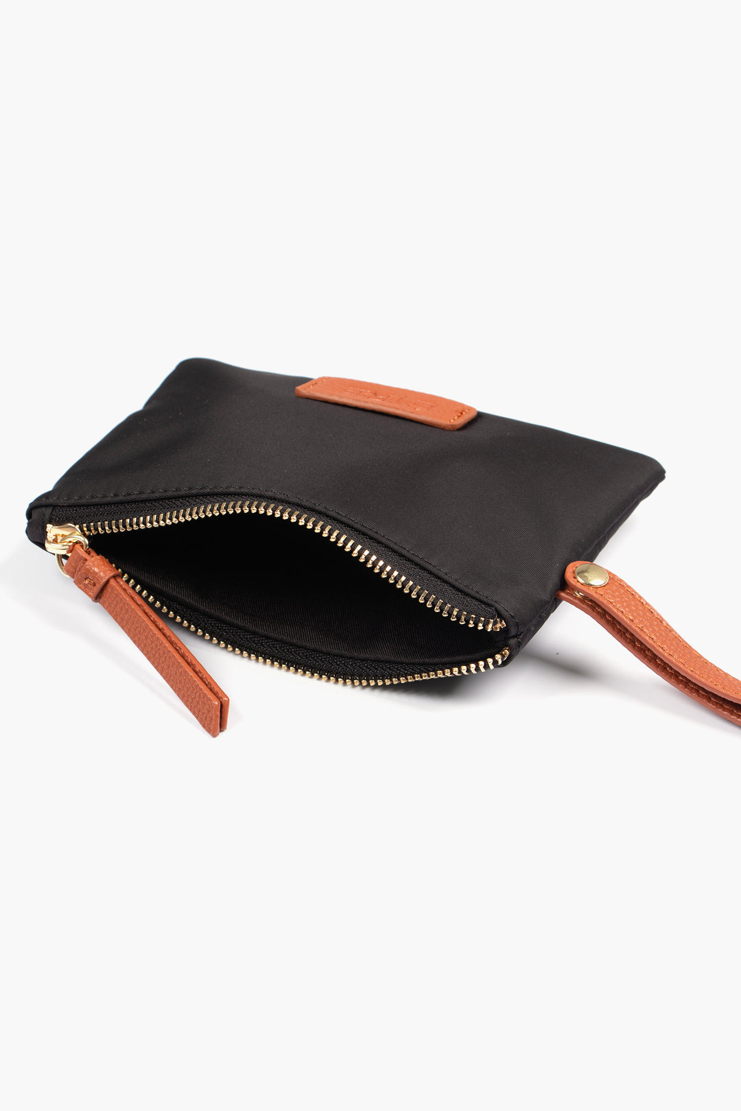 showing the purse laying flat, the zip is open showing a single compartment.