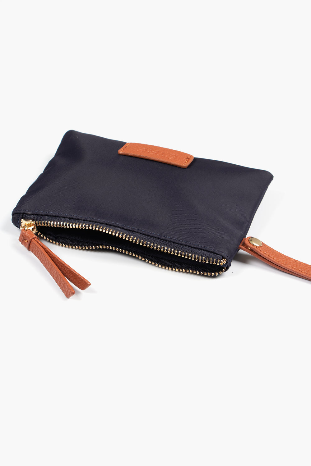 showing the purse laying flat, the zip is open showing a single compartment.