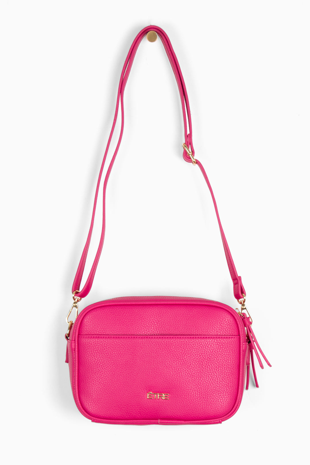 fuchsia pink pebbled faux leather crossbody bag with detachable bag strap and gold hardware