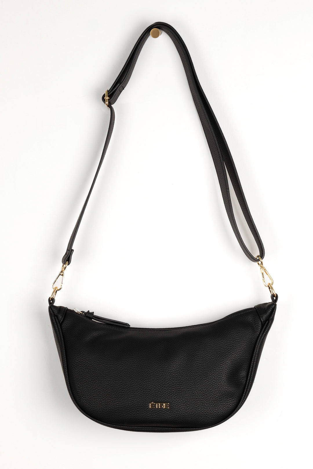 black faux leather crossbody half moon sling bag with detachable bag strap