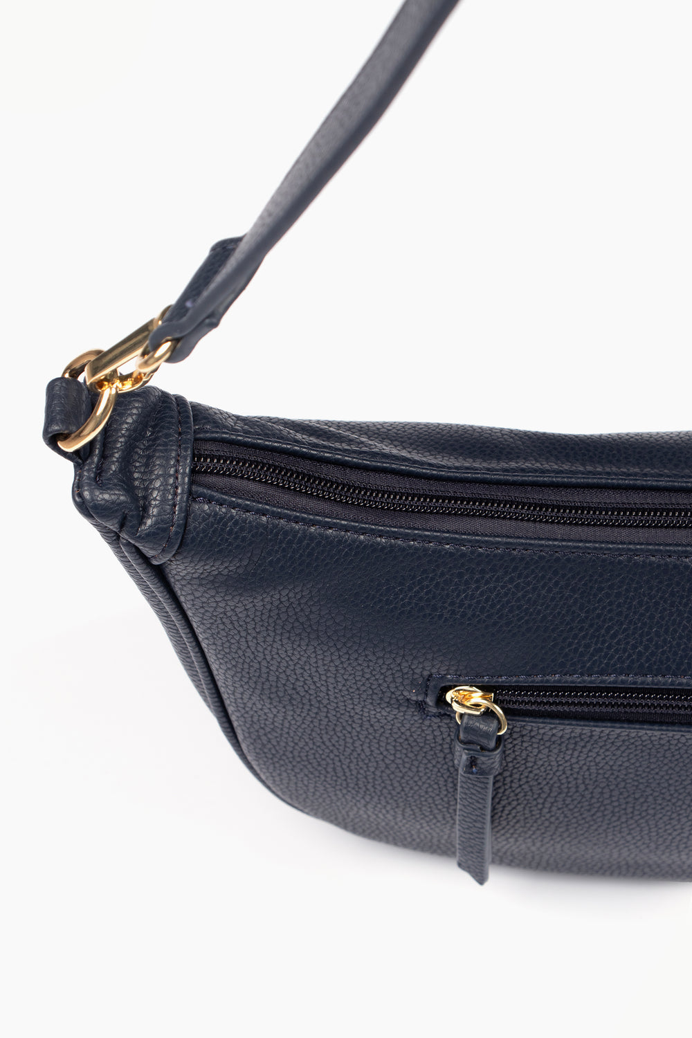 showing the top zipper compartment and a smaller side pocket which is also has a zip closure.