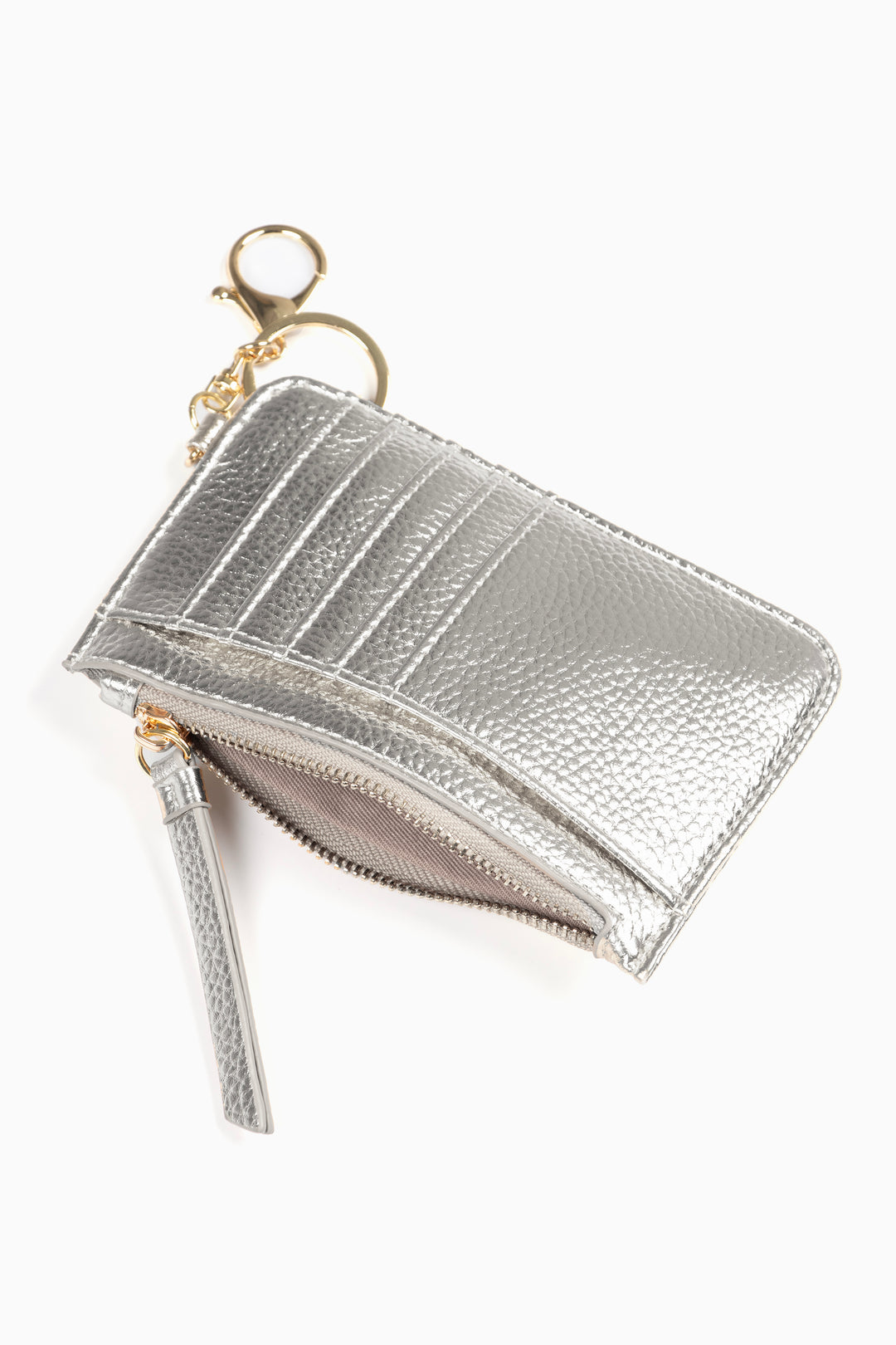 showing the silver card holder laying flat, there is an open zip pocket compartment, also showing are the card slots on the outside of the item 