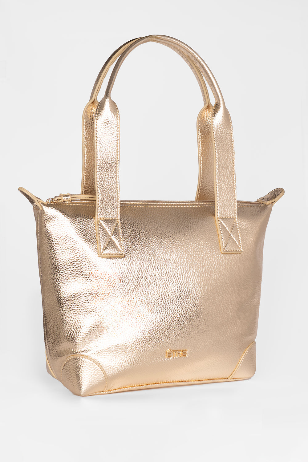 showing the back of the tote bag, there is an external zip pocket on the back of the bag. 