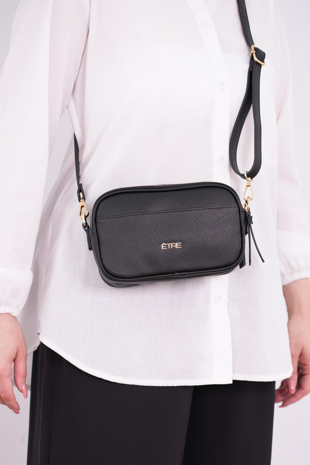 juniper-crossbody-bag-black-textured-pu-worn-by-model