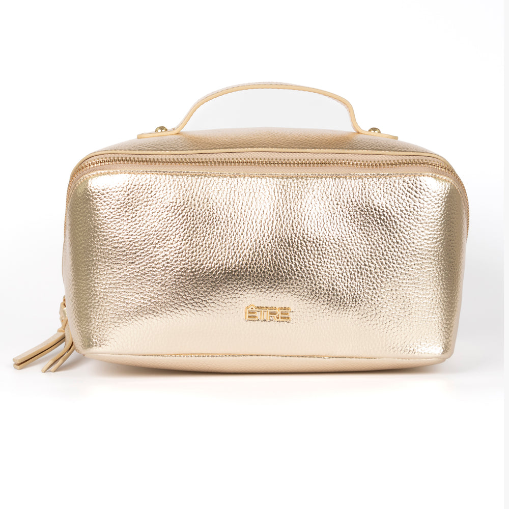 metallic gold faux leather vanity case with a top handle. the cosmetics bag has zip fastening closure