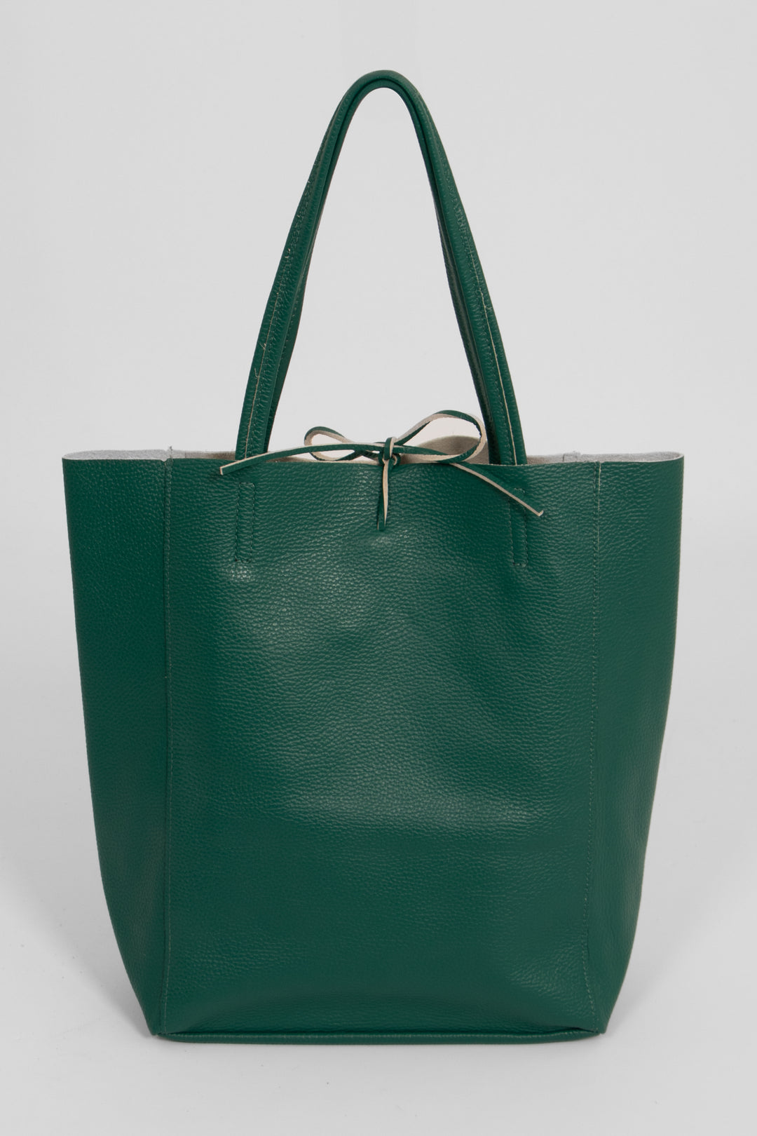 emerald green pebbled leather tote bag with a top tie fastening and thin top carry handles.