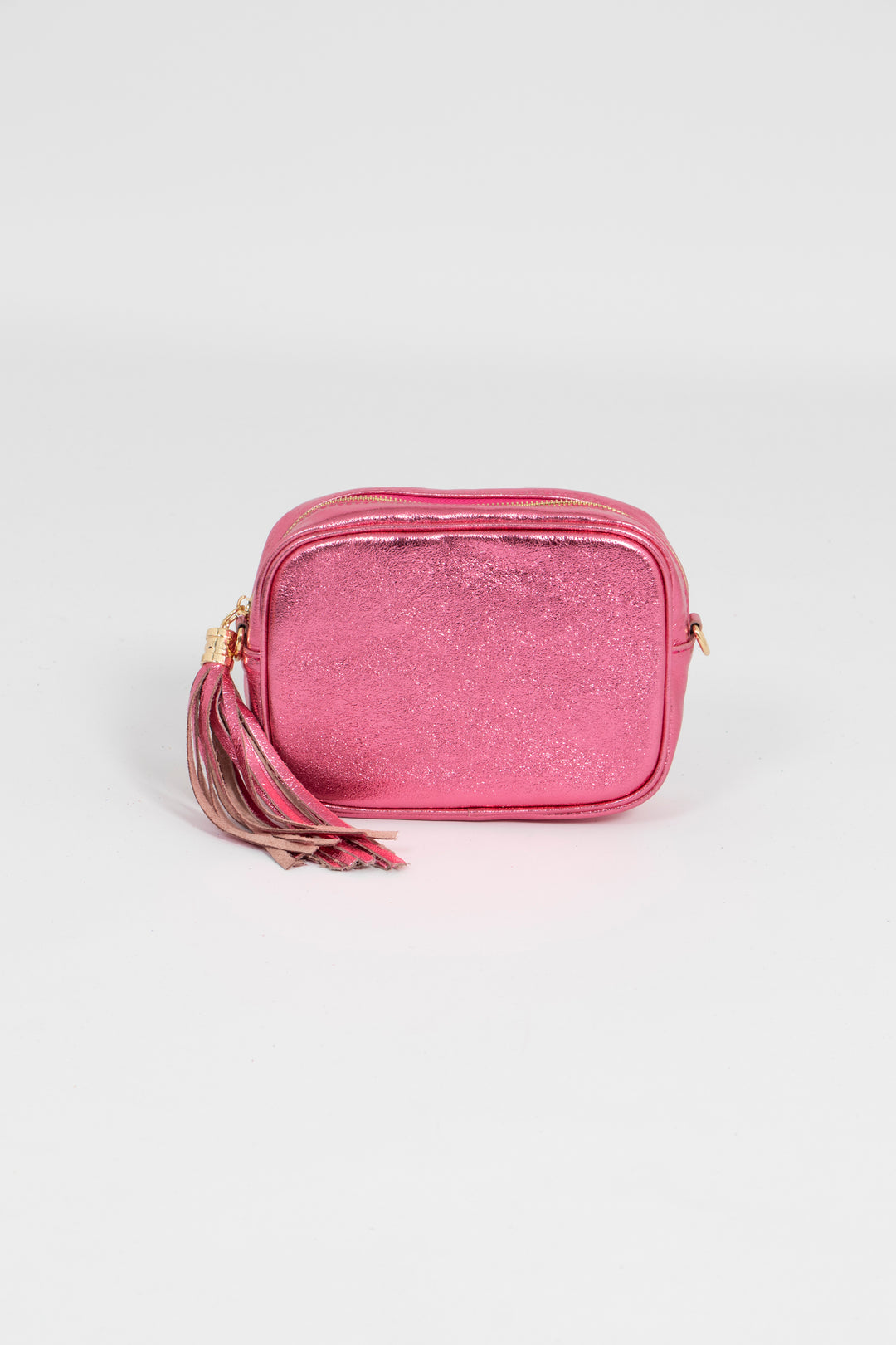 metallic hot pink leather crossbody camera bag with a tassel and matching detachable bag strap