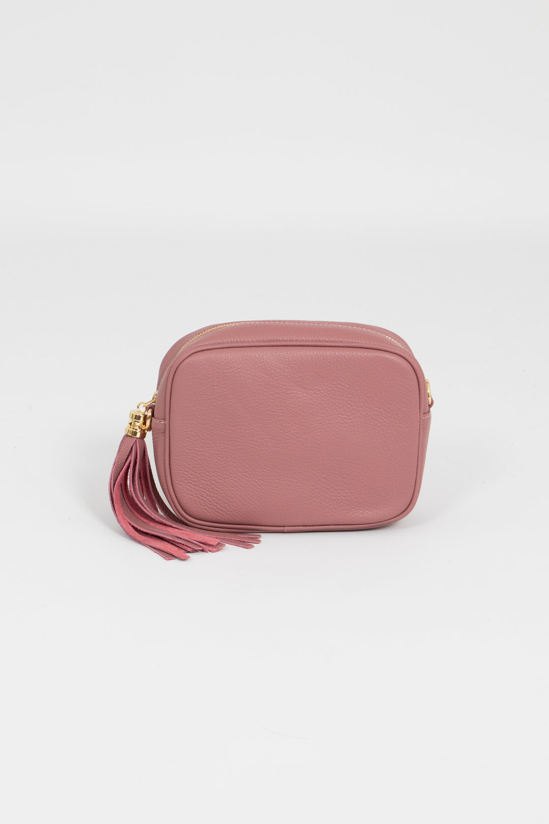 dusty pink pebbled leather crossbody camera bag with a detachable leather strap