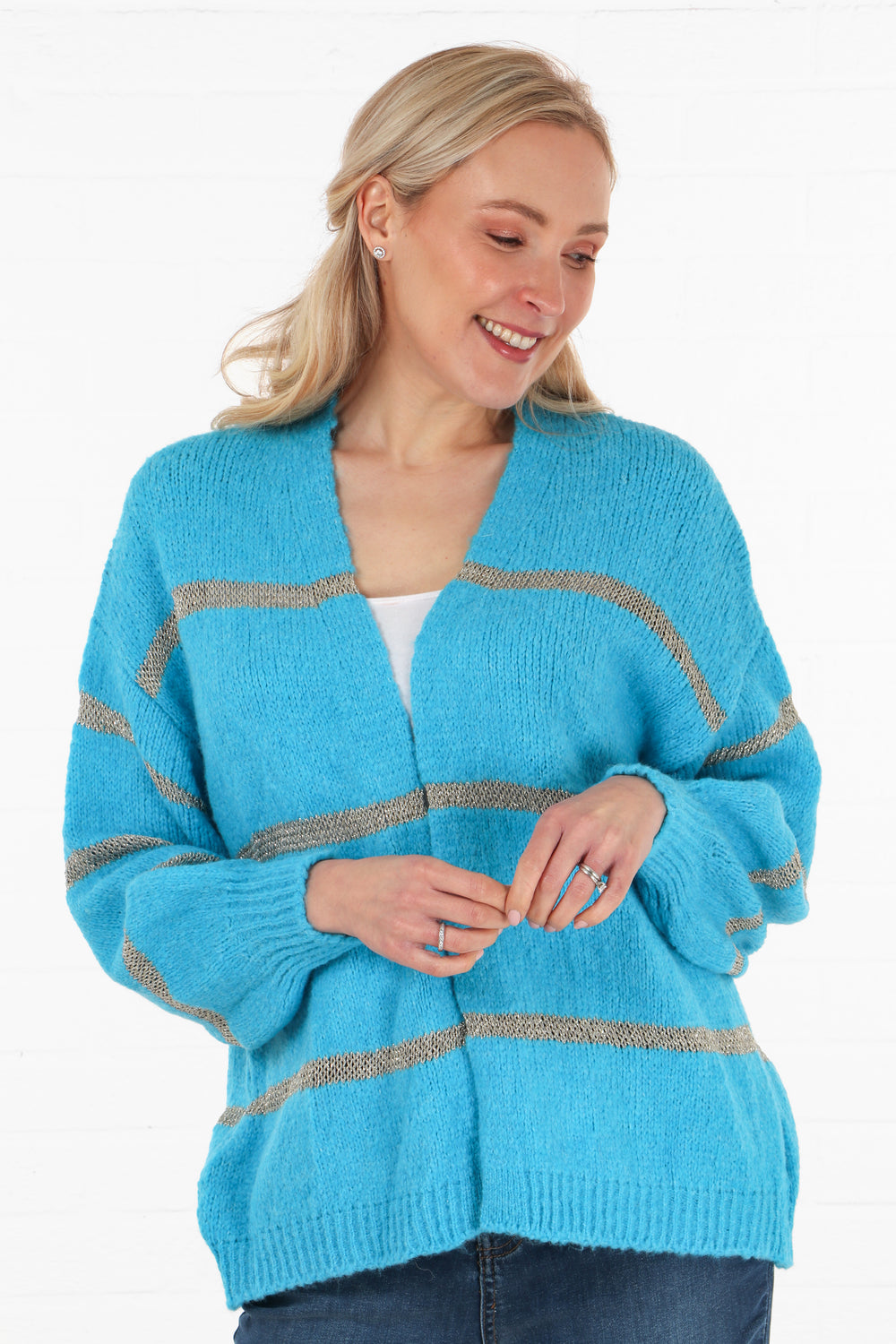 model wearing a one size short knitted cardigan in vibrant blue