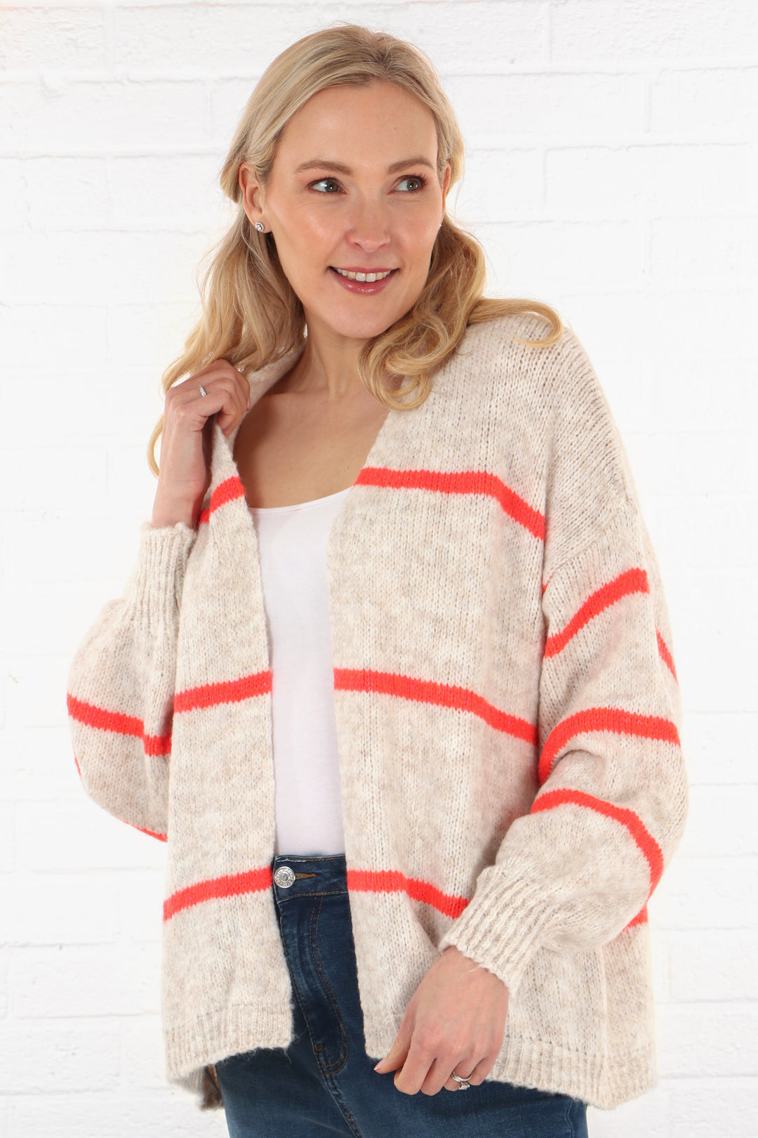 cream open front cardigan with three thin horizontal coral stripes throughout