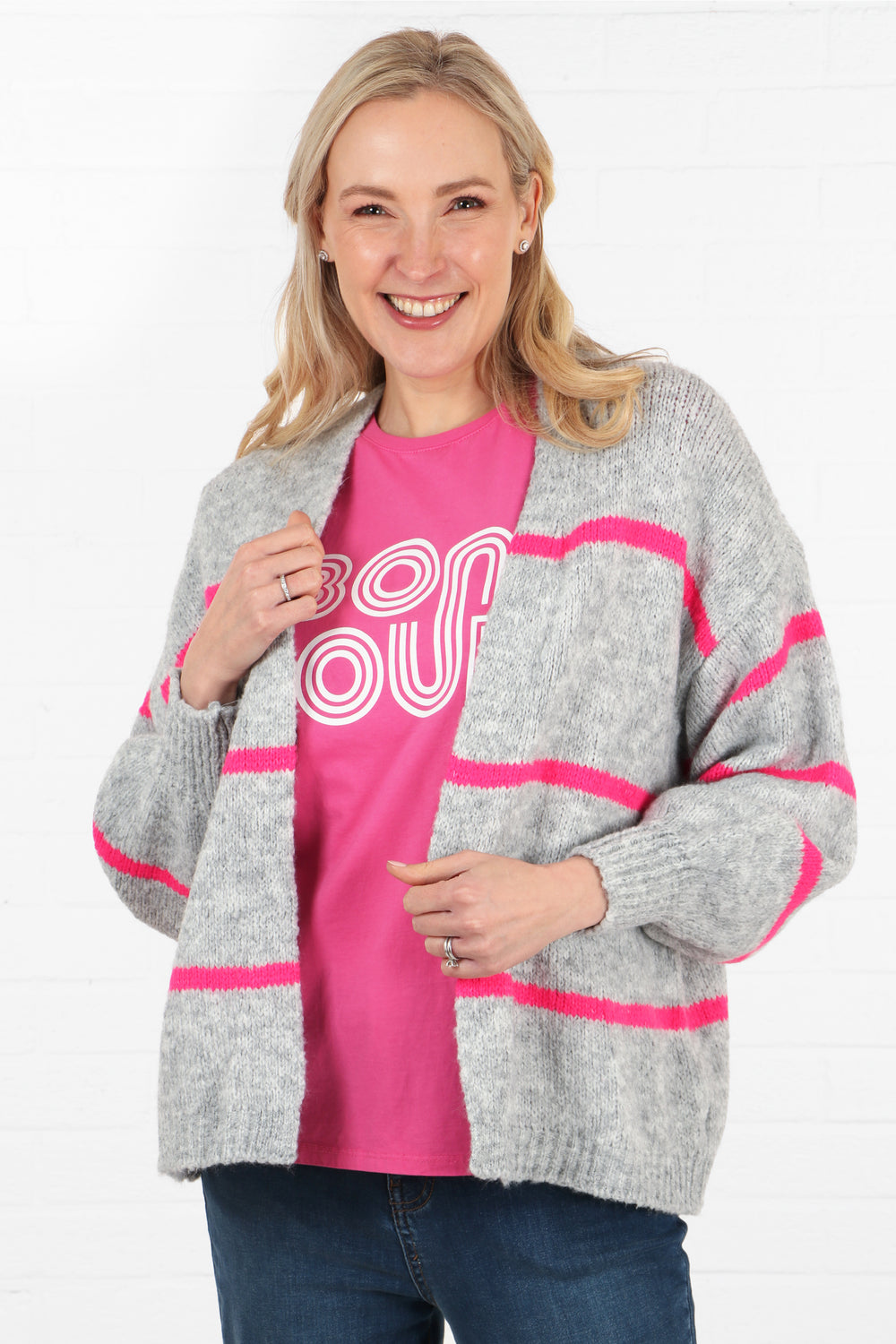 light grey knit cardigan with pink stripes, the cardigan has an open front and balloon sleeves