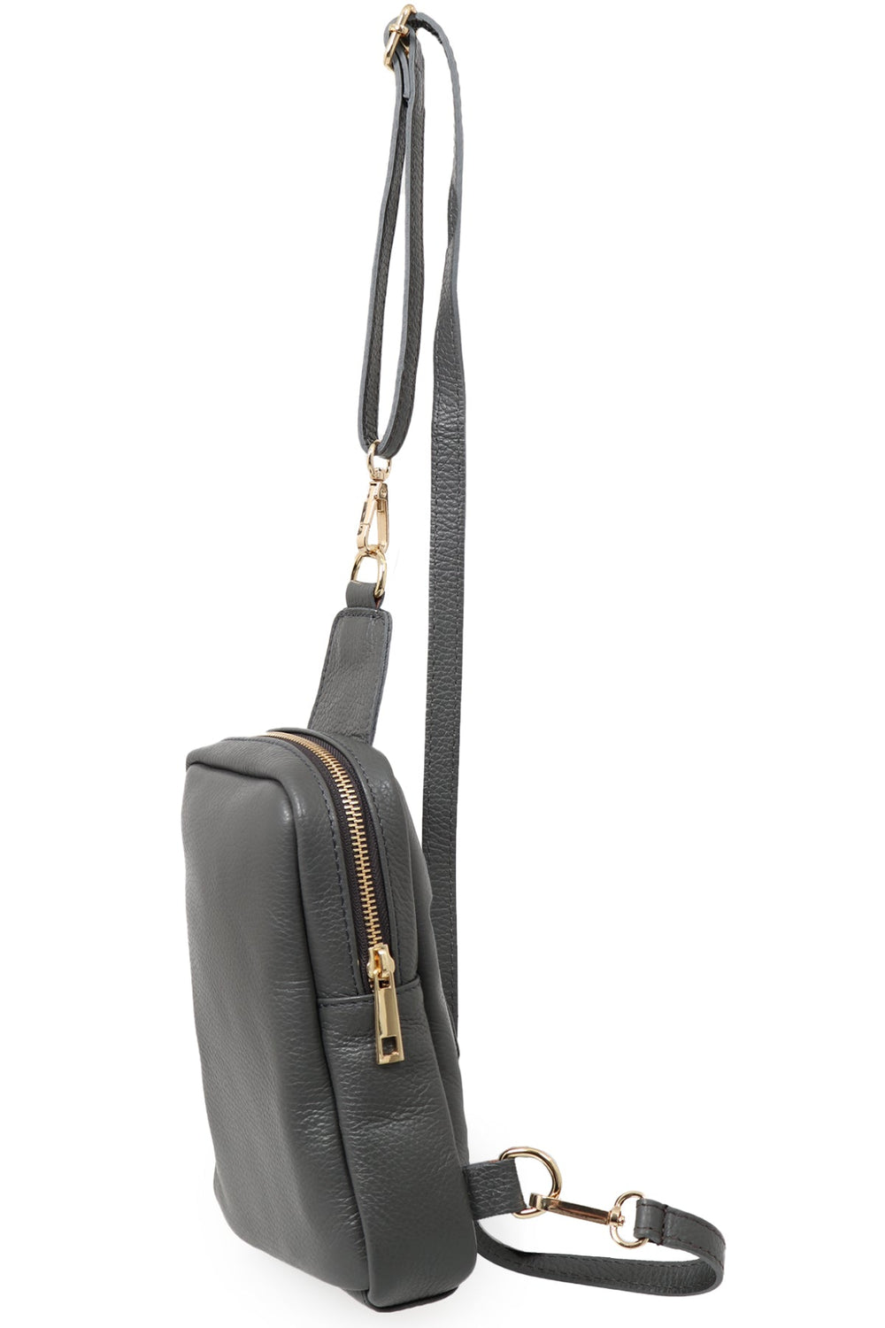 close up of the grey leather sling bag, showing the zip closure and gold hardware