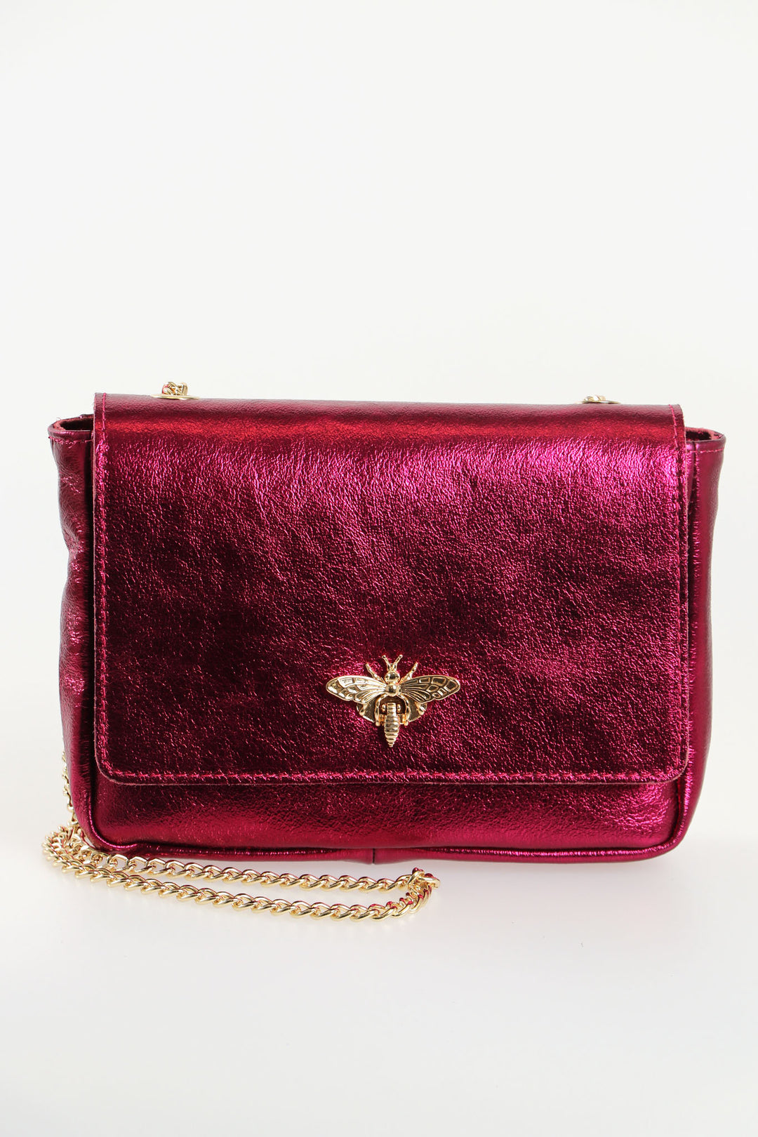 metallic magenta pink leather crossbody bag with a prominent gold bee clasp on the front and a classic cuban link chain strap