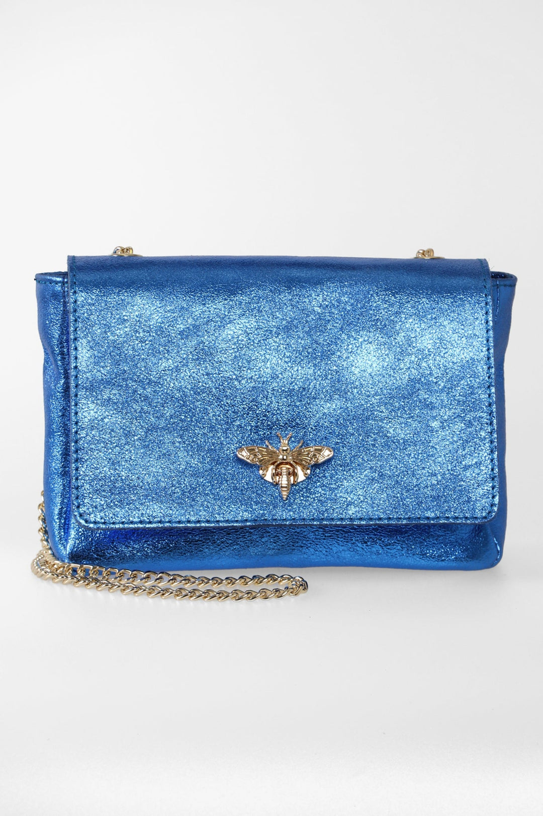 metallic royal blue leather crossbody bag with a prominent gold bee clasp on the front and a classic cuban link chain strap