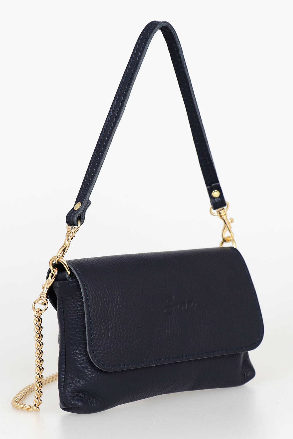 side view of the small cross body bag, showing the folding front closure, gold chain strap and detachable handle strap