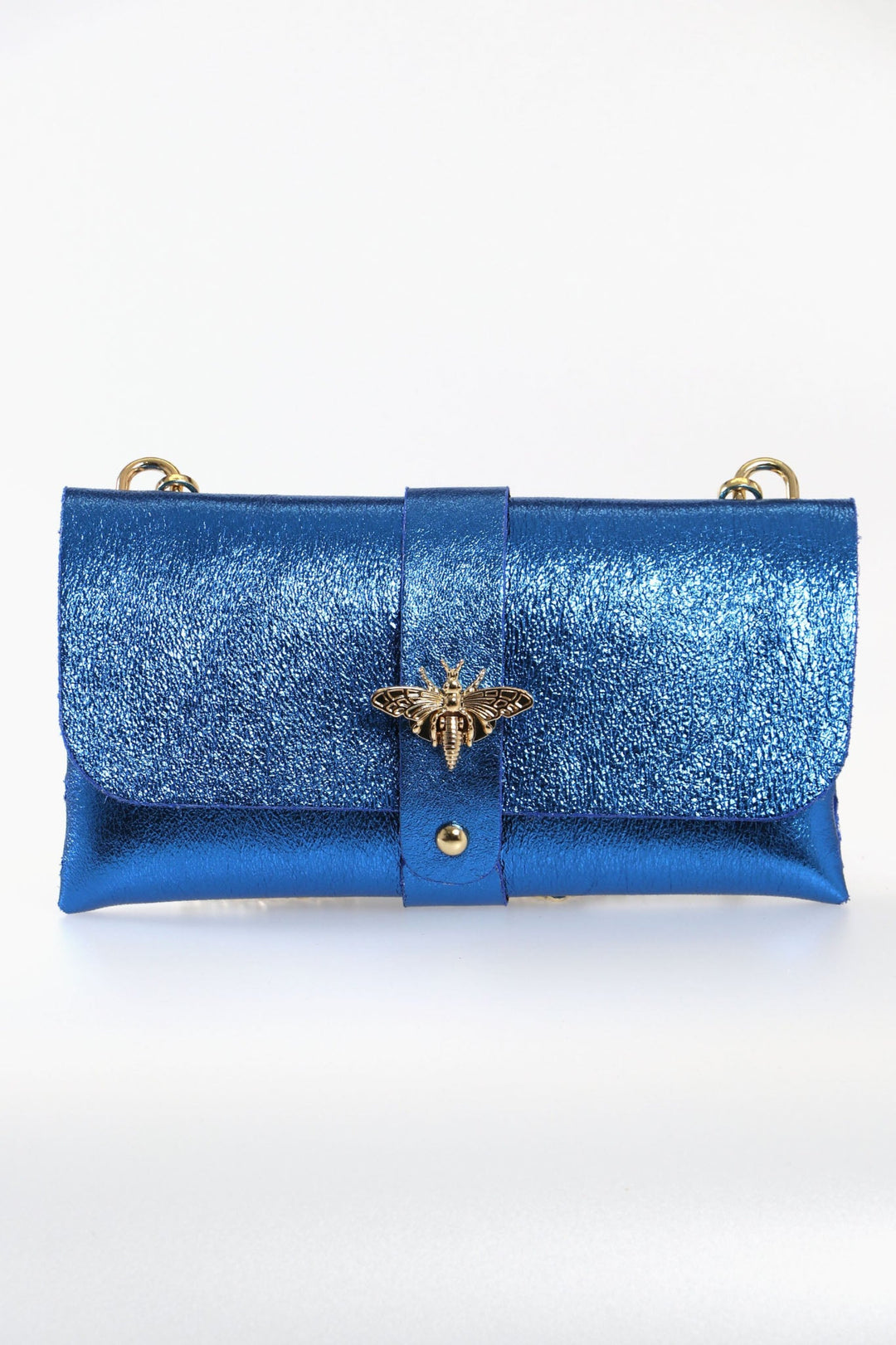 metallic royal blue clutch bag with a large bee clasp fastening and a long gold coloured chain strap