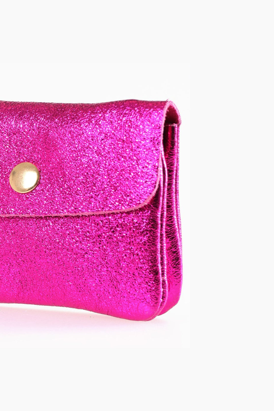 close up of the metallic leather, showing an all over shimmery appearance and vibrant pink colour
