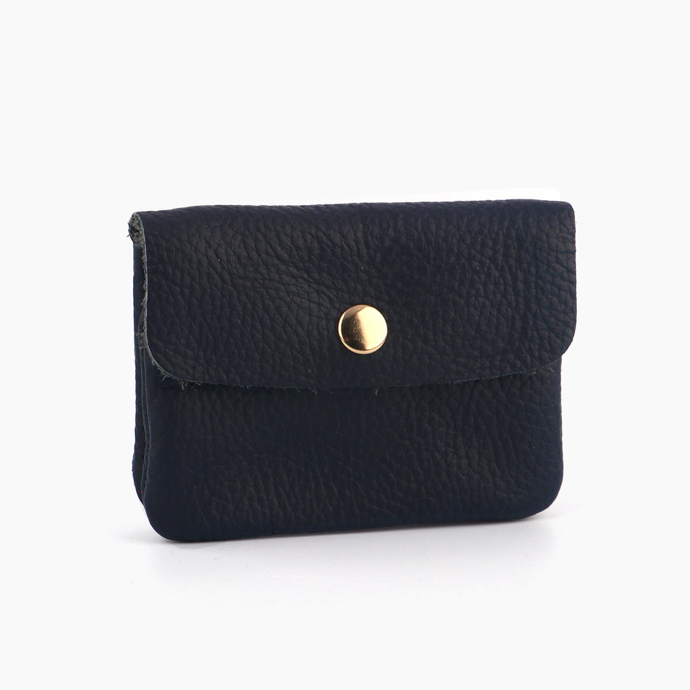 navy blue pebbled leather coin purse with an outer button closure. the button is gold coloured