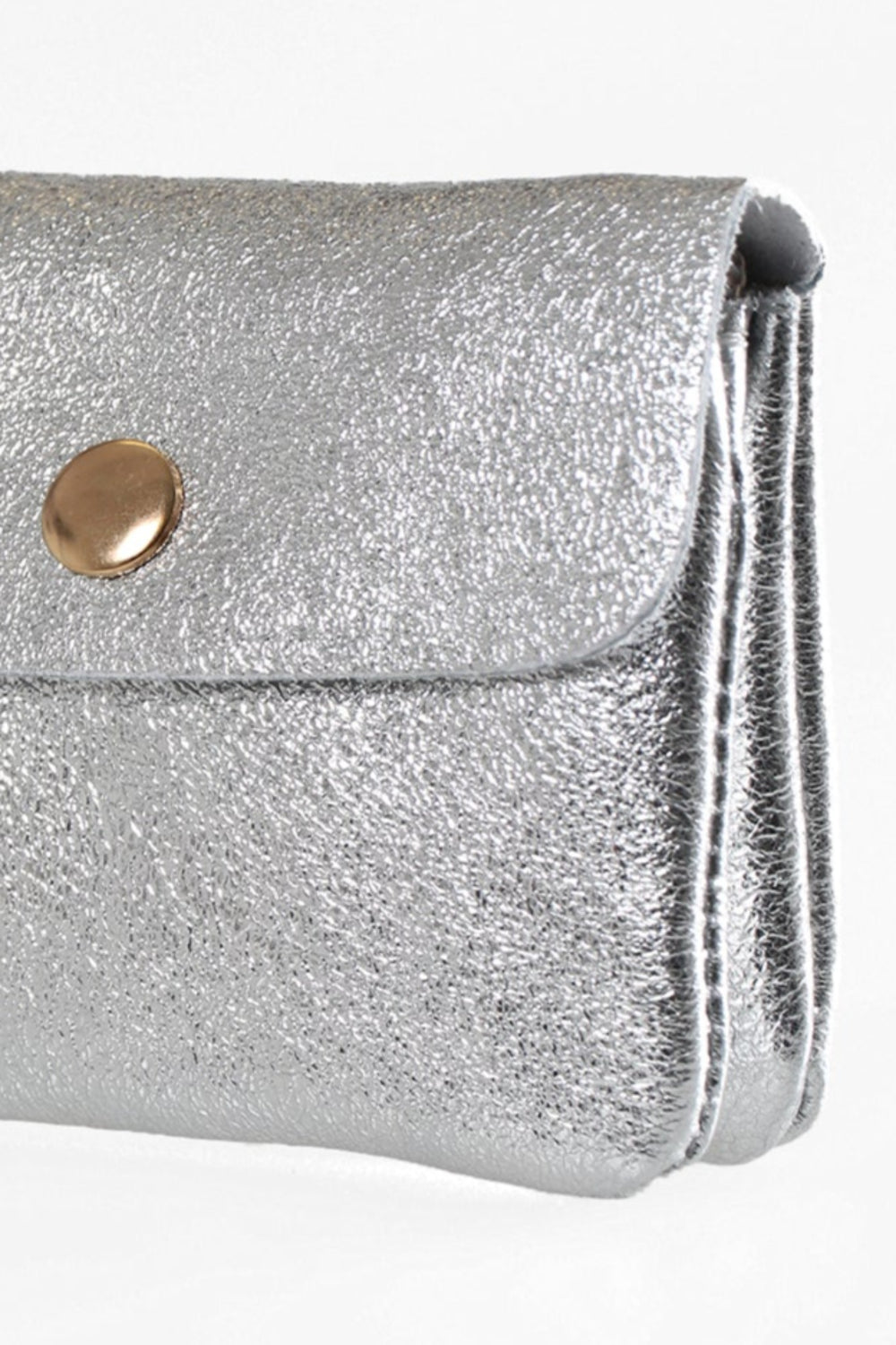 close up of the metallic silver leather, the small coin purse has a shiny appearance