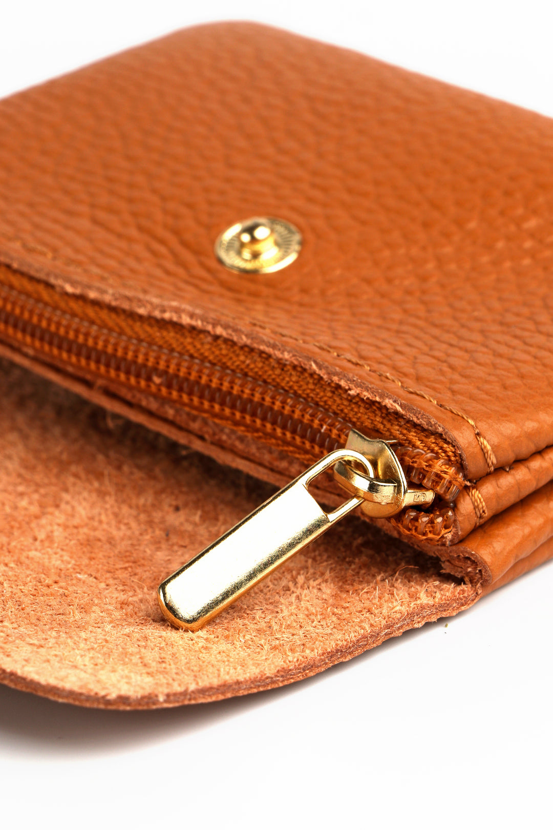 showing the inside of the leather coin purse showing an internal zip closure compartment
