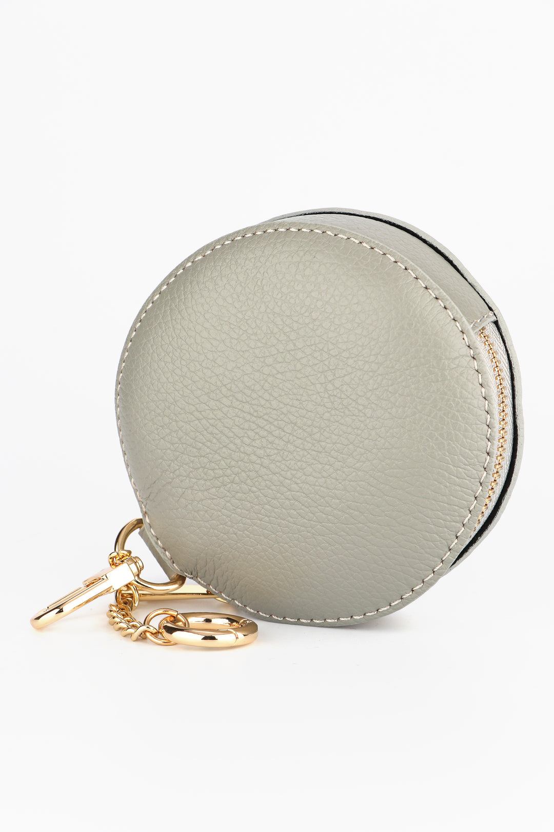light grey round italian leather coin purse with a zip closure and two clip on keychains