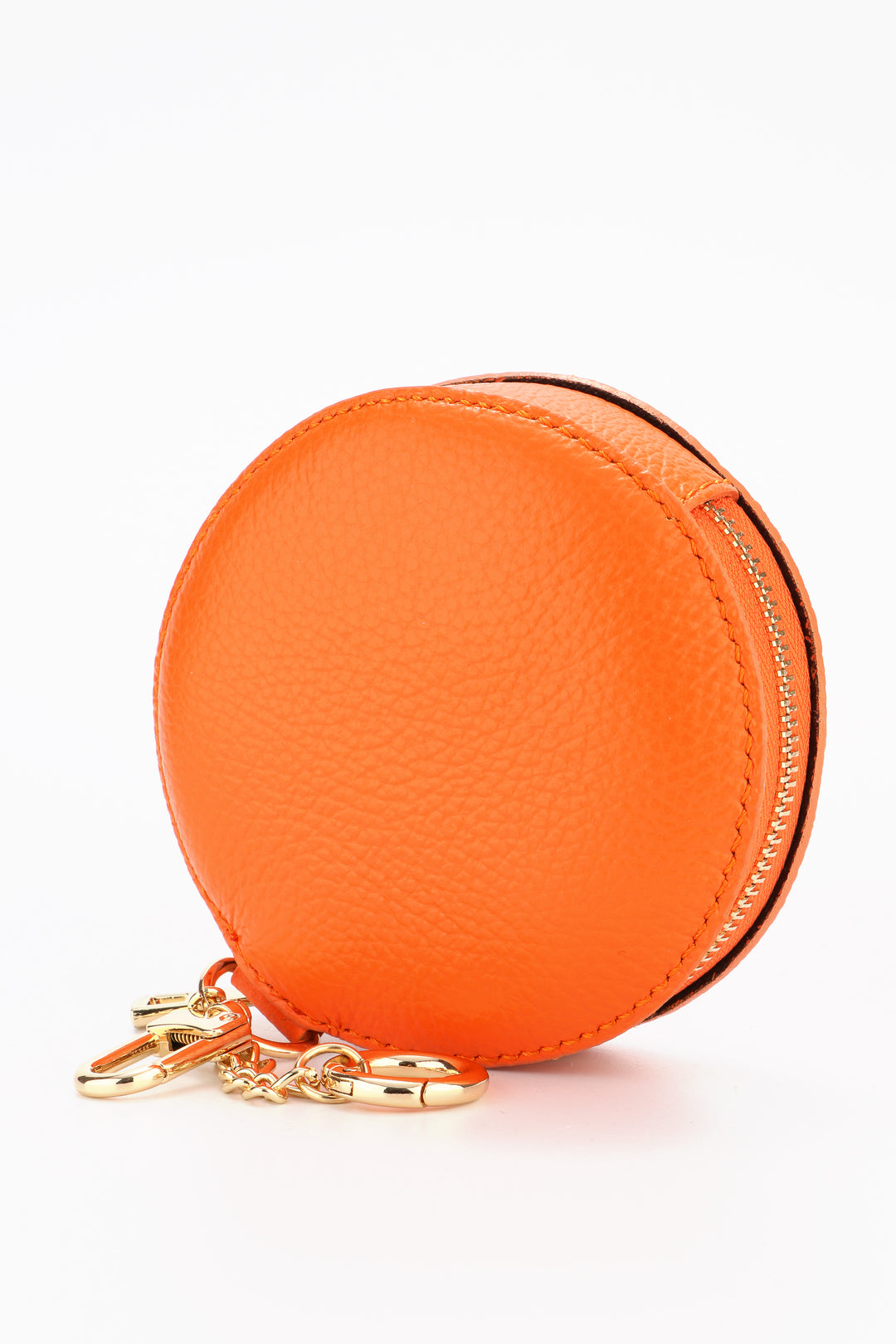 orange leather round clip on coin purse with a zip closure and two gold attachment keyrings