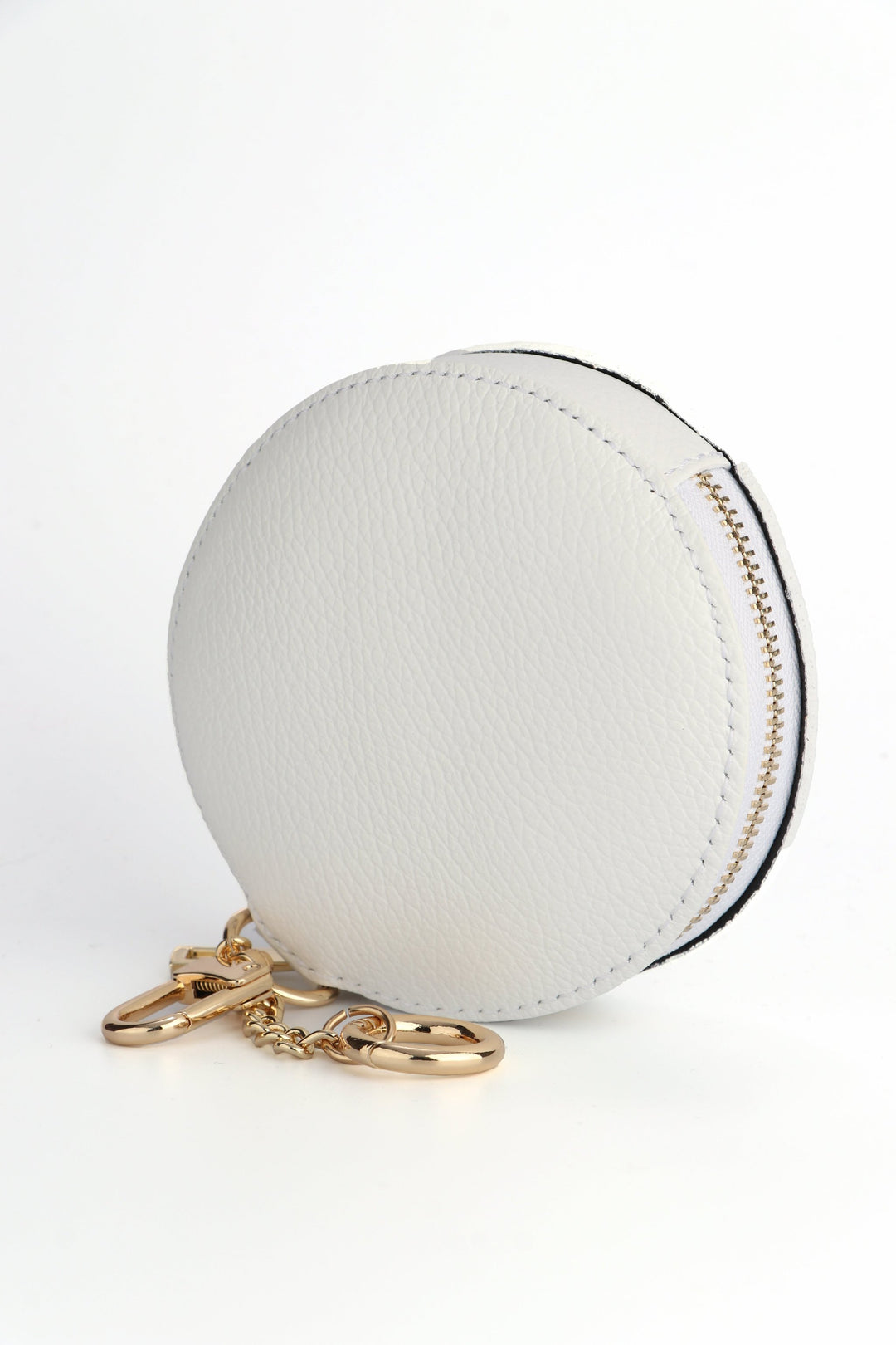 white leather round coin purse with clip on keyring attachments and a gold zip closure