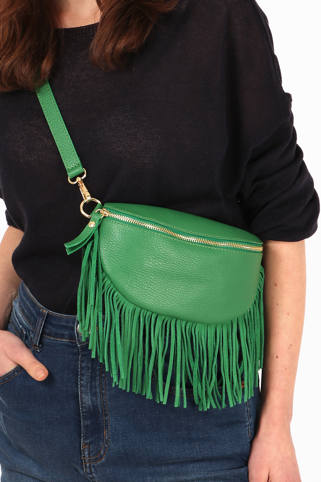 close up of the bright green leather half moon crossbody bag