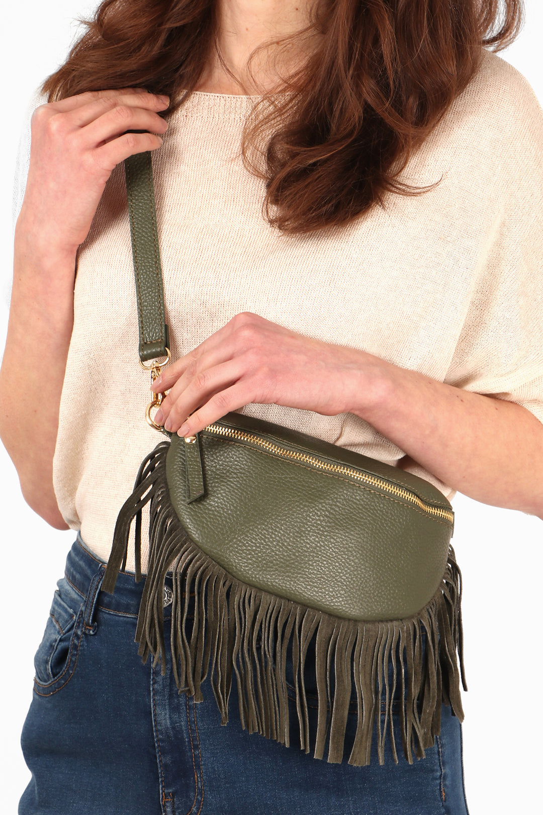 close up of the khaki green leather half moon fringed bag