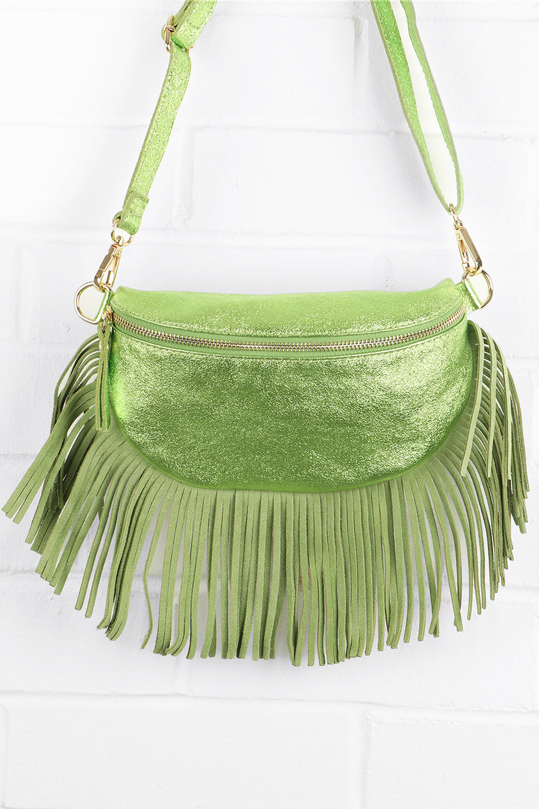 metallic lime green leather halfmoon bag with fringed trim and zip closure