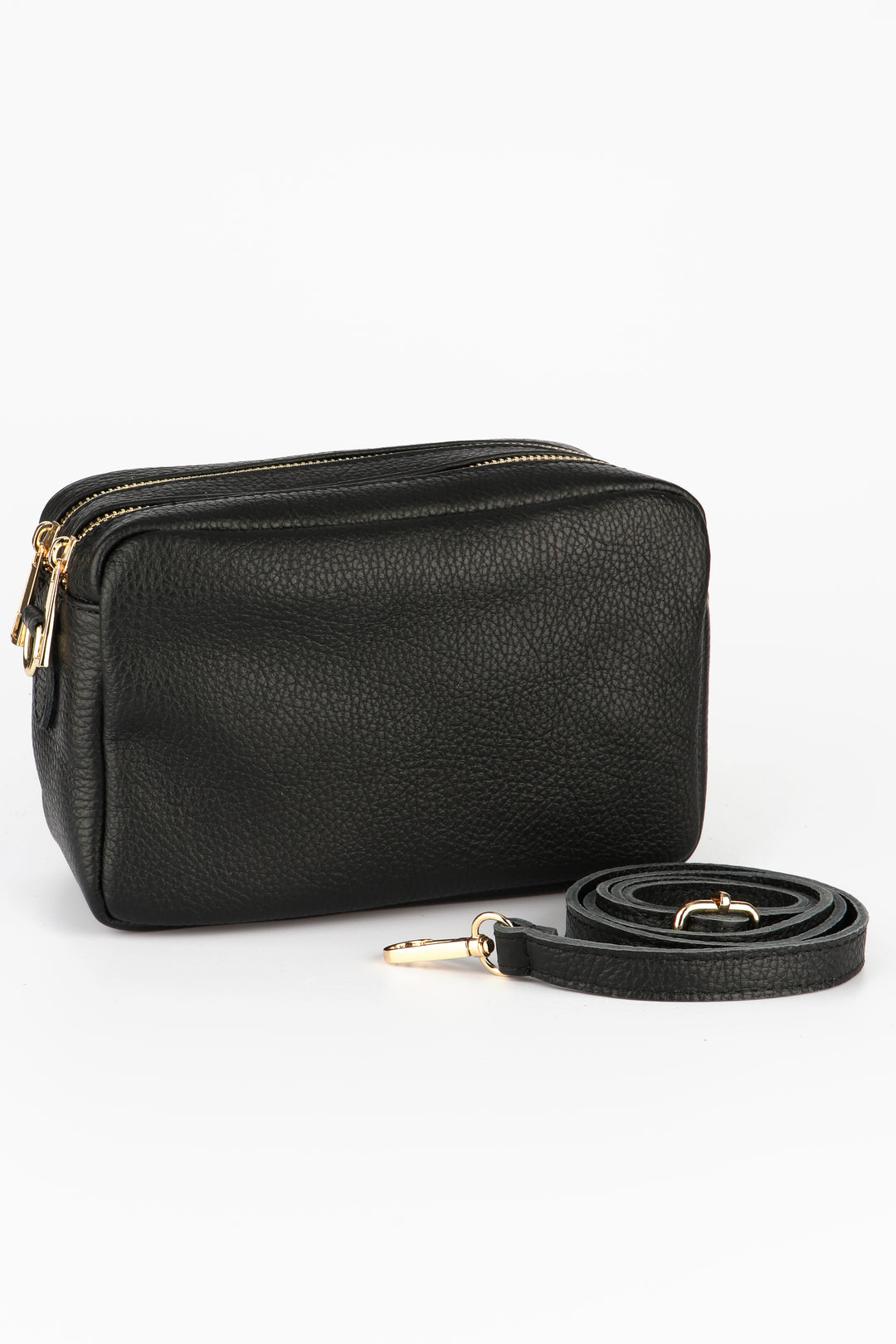 black leather crossbody camera bag with two zip closing compartments and a detachable bag strap