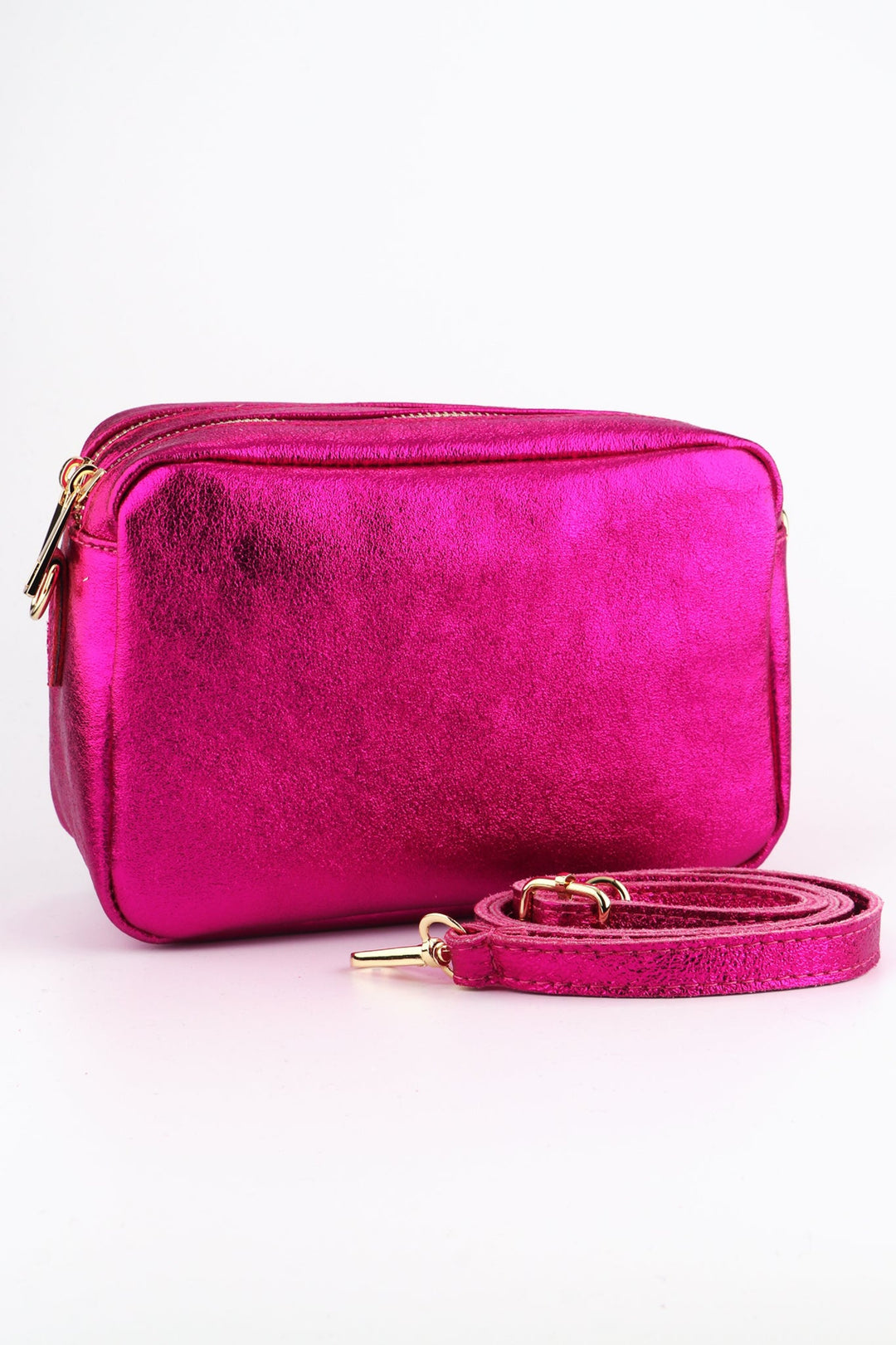 metallic pink leather cross body camera bag with a matching detachable bag strap and two zip closing compartments