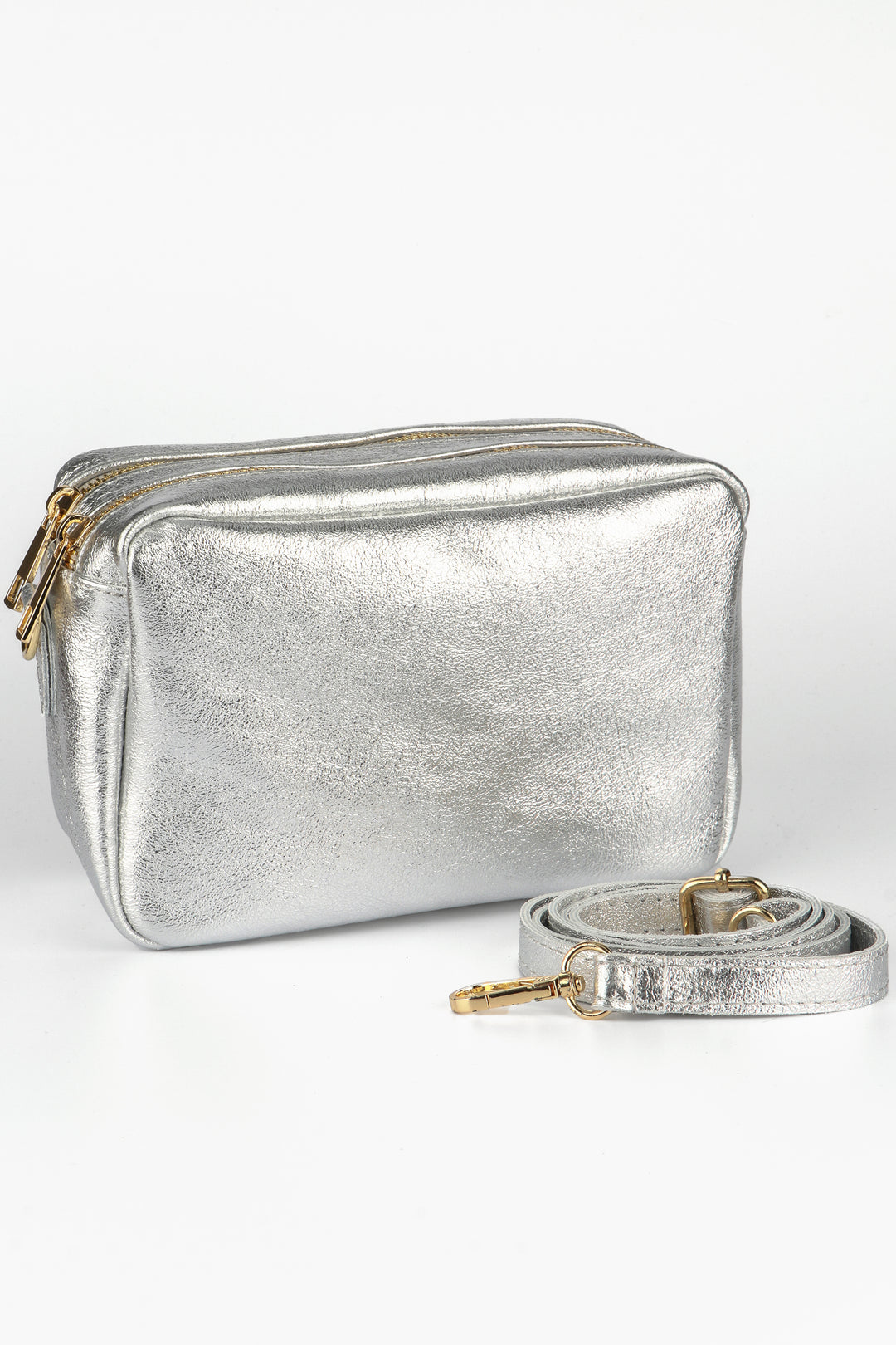 silver leather cross body camera bag with a matching detachable bag strap and two zip closing compartments