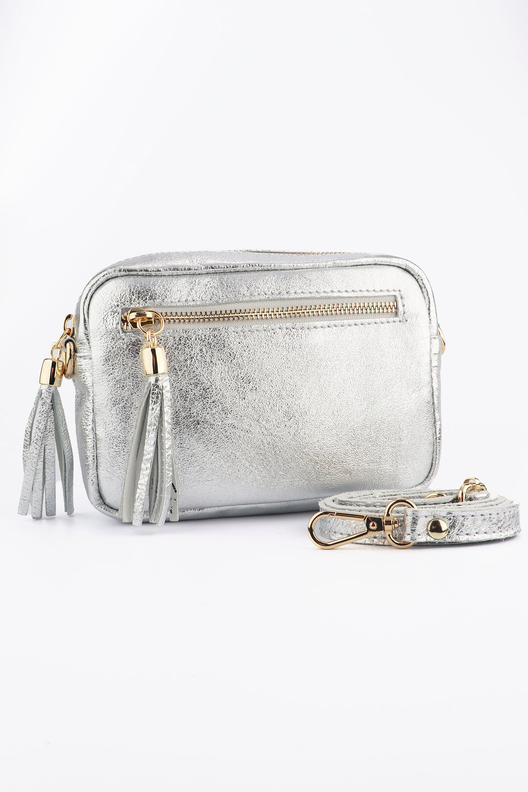 silver leather crossbody camera bag with two zip closing compartments and tassles with a cross body detachable strap