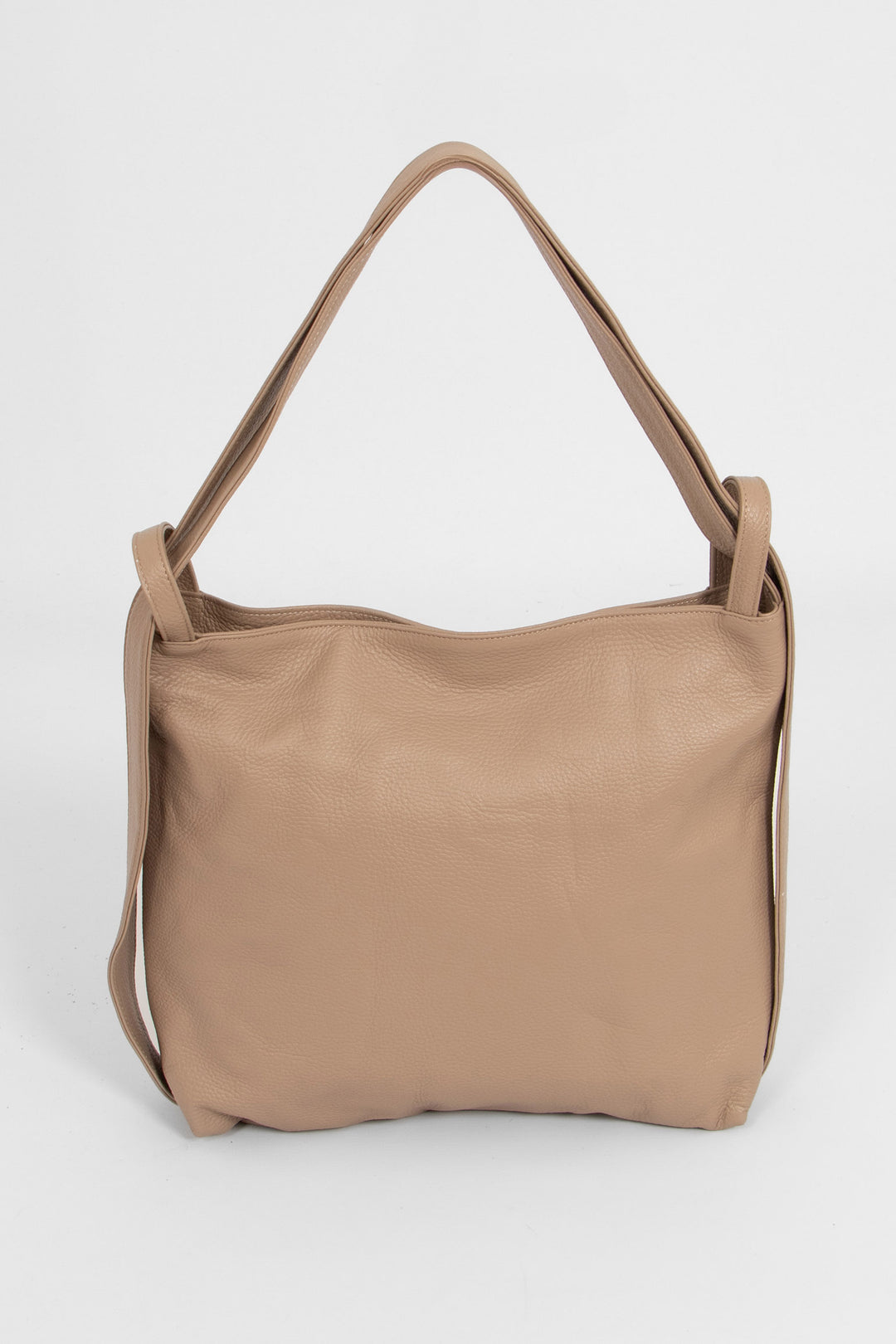 taupe leather convertible backpack tote bag. the strap can be repositioned to allow the bag to be worn as a back pack or over the shoulder