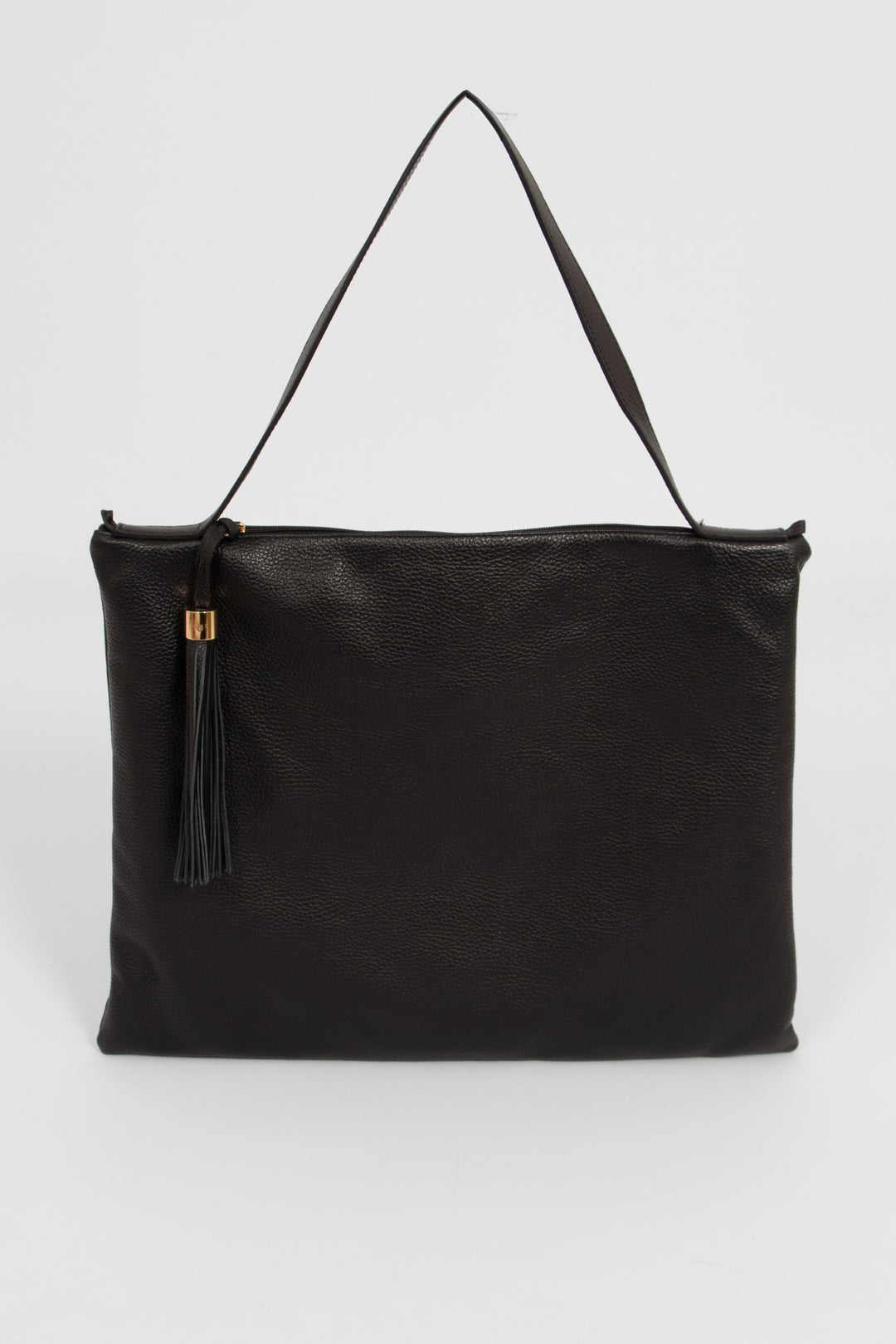 large black leather tote bag with a shoulder strap on the top of the bag and a decorative tassel on the front